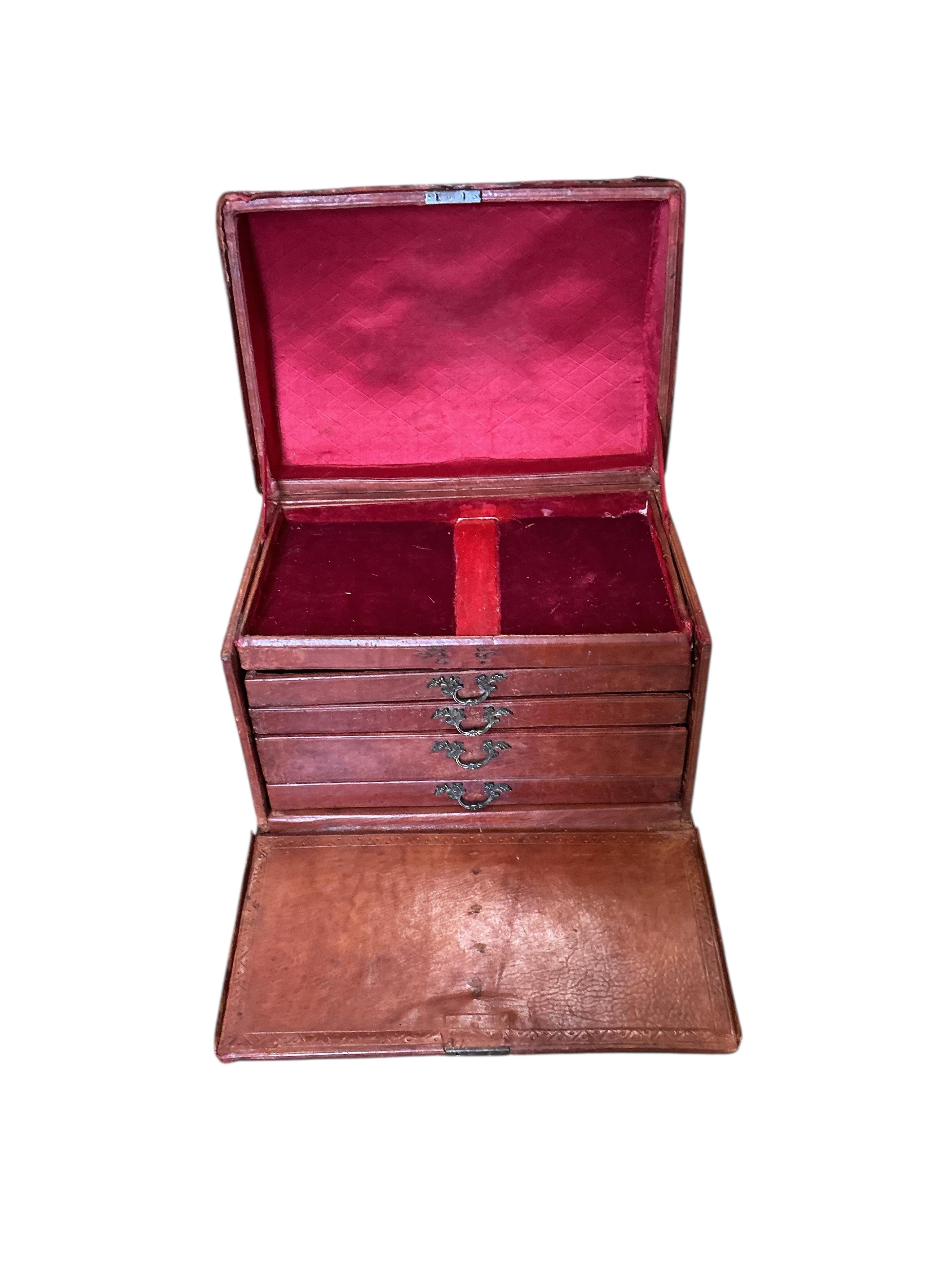 A small 18th century style studded domed top leather covered trunk with internal drawers, width 50cm, depth 35cm, height 37cm